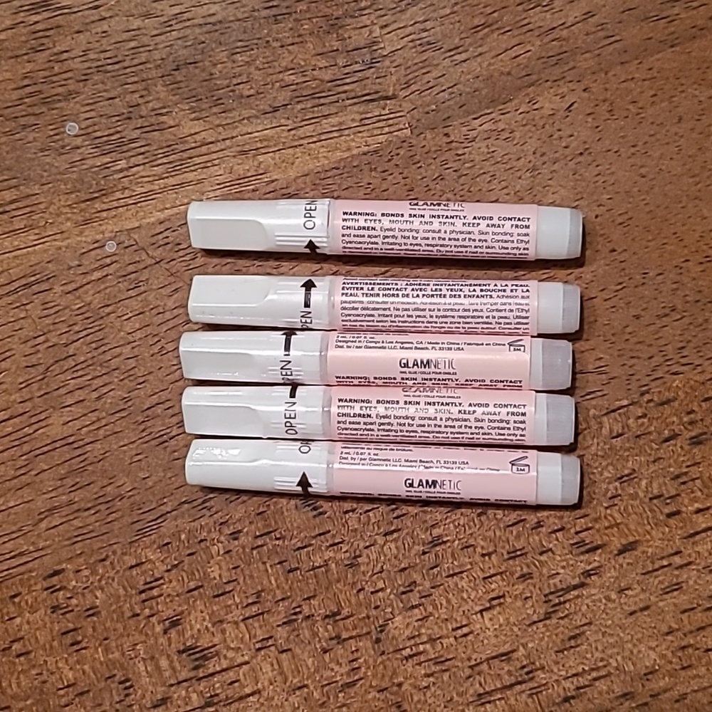 Unopened bottles of glamnetic nail glue
